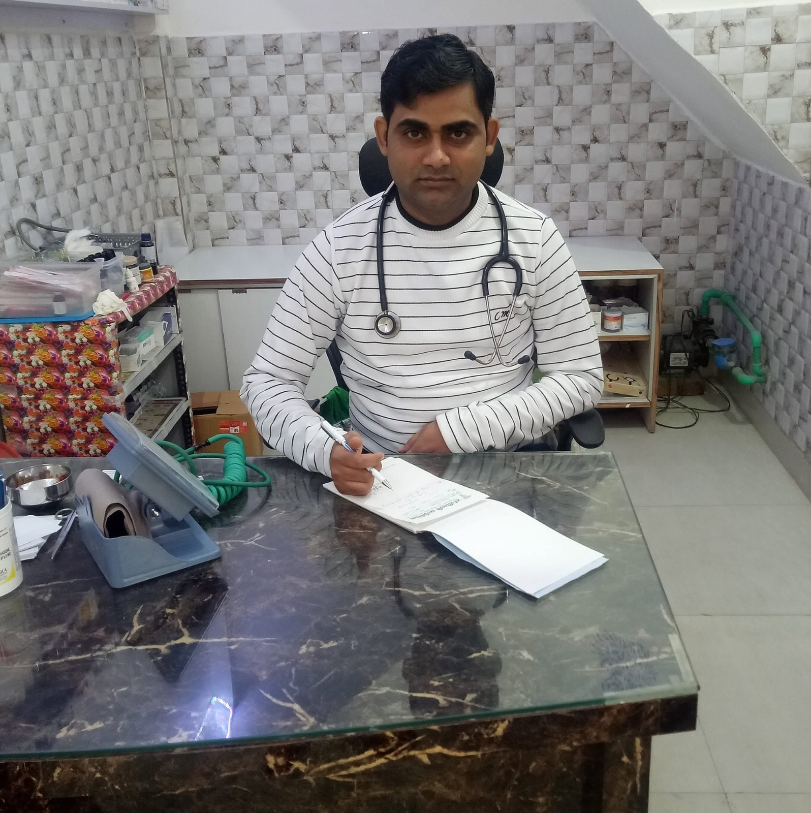 Dr. B.P. Singh at his consulting desk in Sanjeevani Clinic